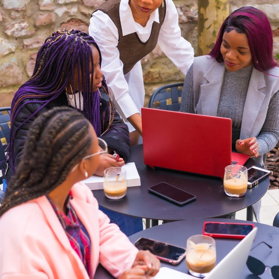 Young businesswomen of black ethnicity. At a business meeting in a cafeteria. Teamwork